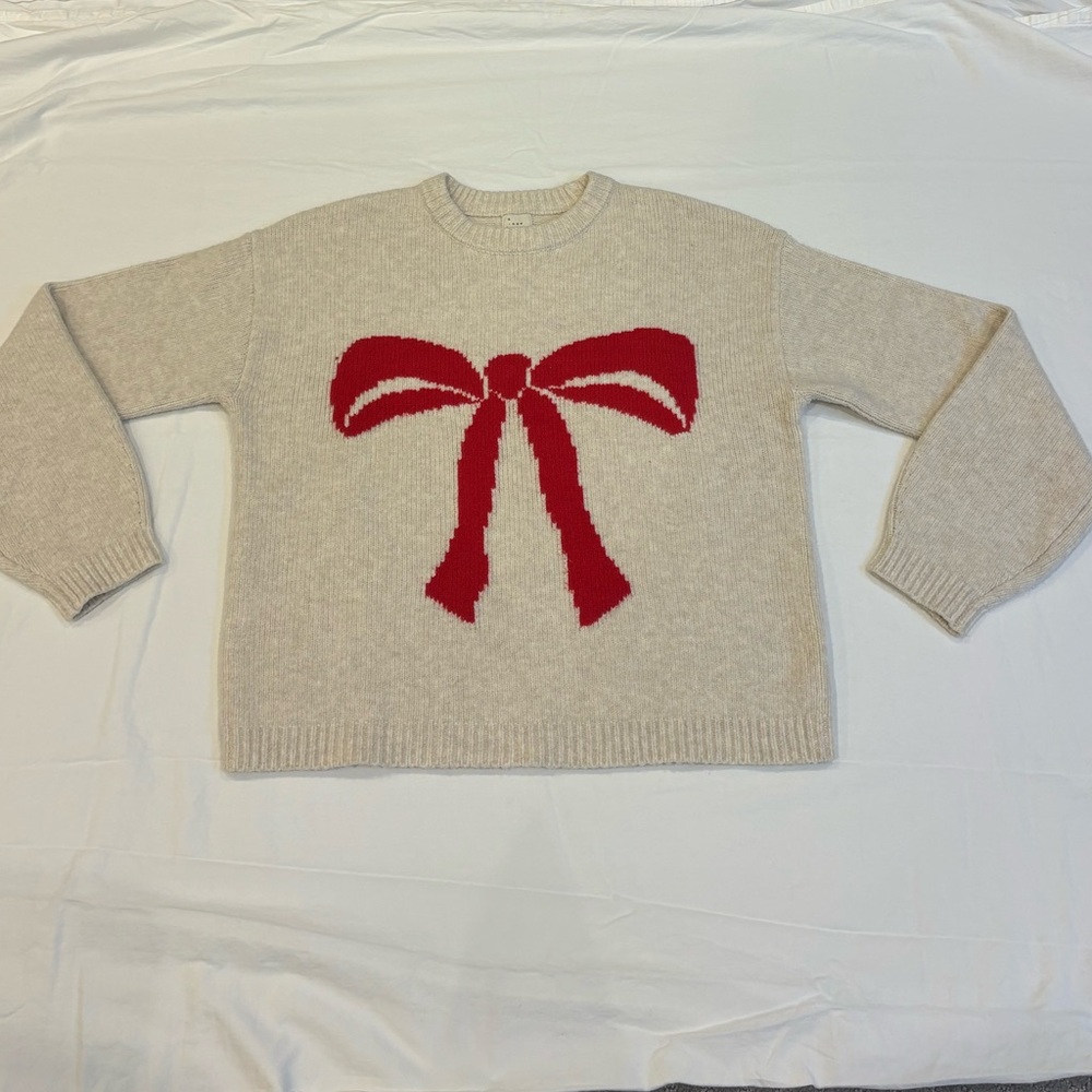 a new day Cream Sweater with Red Bow